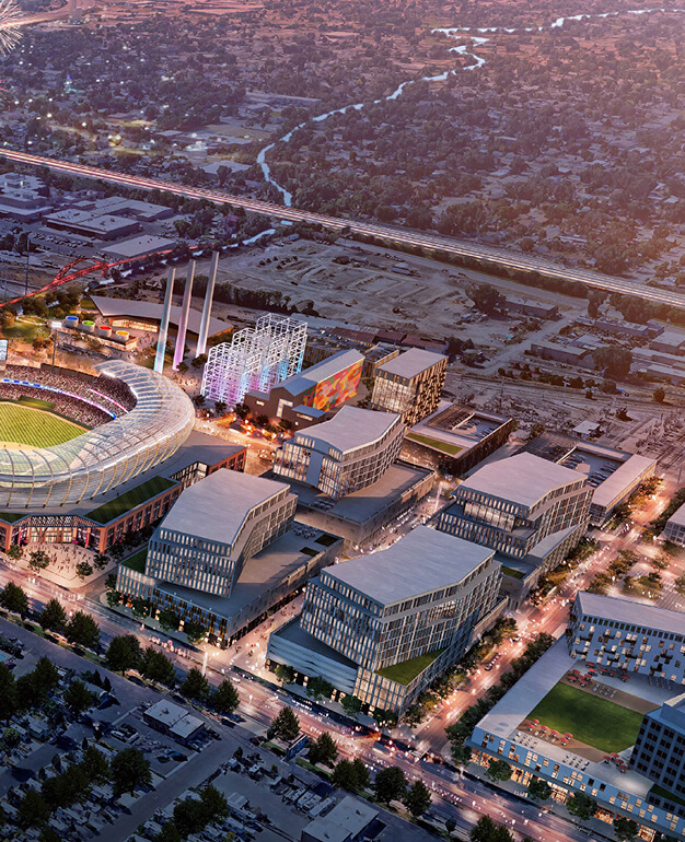 Aerial view of a modern stadium in the Salt Lake westside business district, surrounded by contemporary buildings, roads, and green spaces during sunset—a prime spot for MLB expansion Salt Lake City or shovel-ready development Utah.
