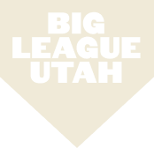 A cream-colored home plate shape featuring "BIG LEAGUE UTAH" in bold white capital letters at the center, reflecting the spirit of Salt Lake's westside business district and shovel-ready development in Utah.