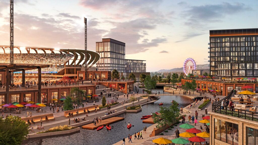 Una animada zona urbana a lo largo del río Jordan de North Temple con un estadio, edificios modernos, un canal con kayaks, asientos al aire libre, sombrillas coloridas y una rueda de la fortuna al fondo al atardecer, insinuando la emoción de una futura expansión de la MLB en Salt Lake City.