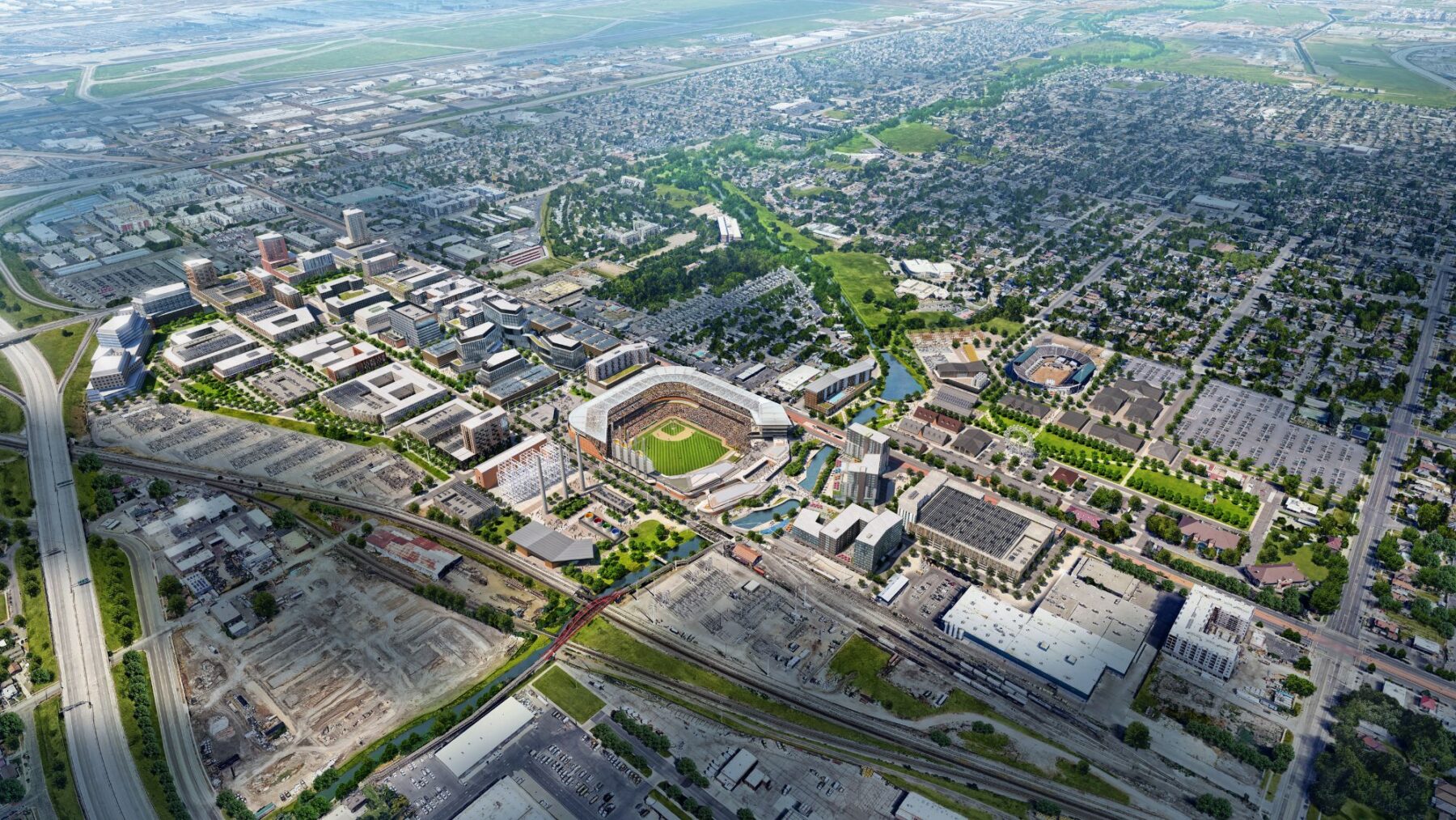 Vista aérea de un gran estadio deportivo en el distrito comercial del oeste de Salt Lake, rodeado de edificios urbanos, estacionamientos, carreteras y barrios residenciales: un sitio ideal para la expansión de la MLB en Salt Lake City y un desarrollo listo para comenzar en Utah.