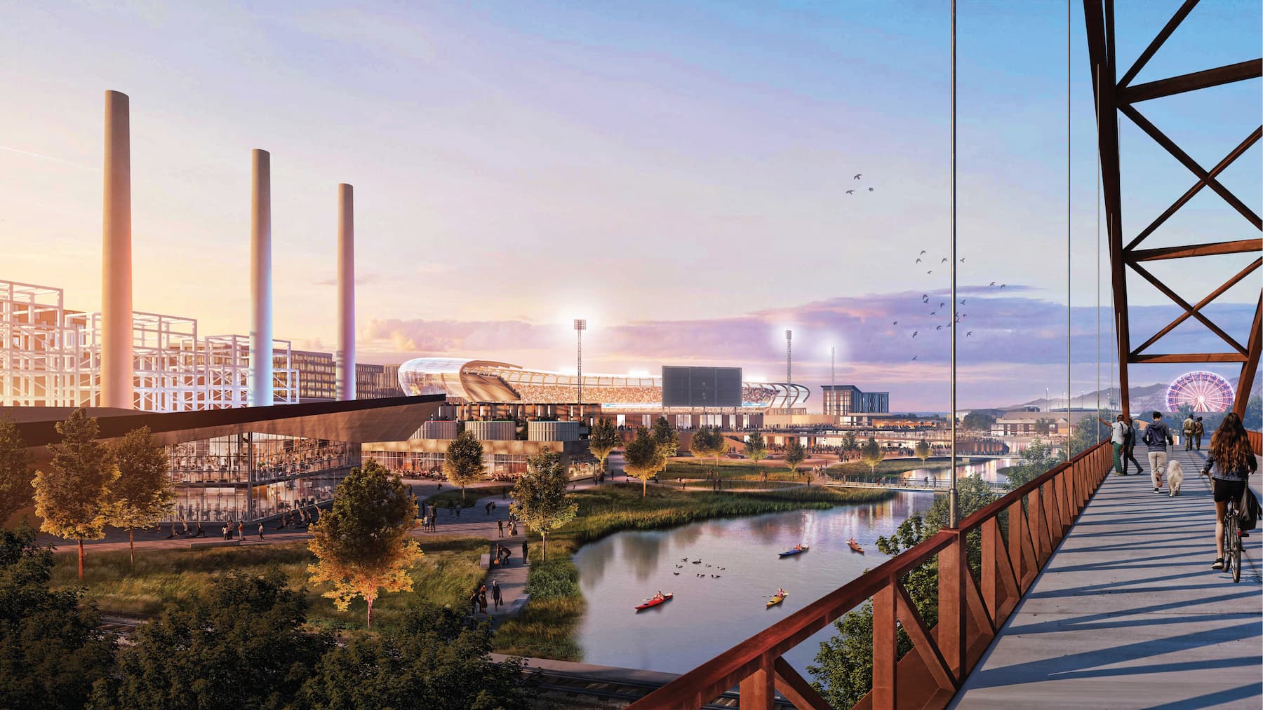 A modern urban waterfront scene along the North Temple Jordan River, featuring a stadium, tall chimneys, kayakers on the river, trees, and people walking on a bridge at sunset.